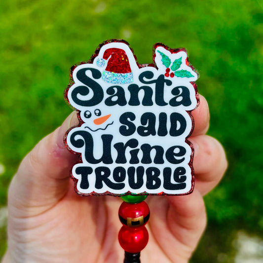 Santa said Urine Trouble Badge Reel